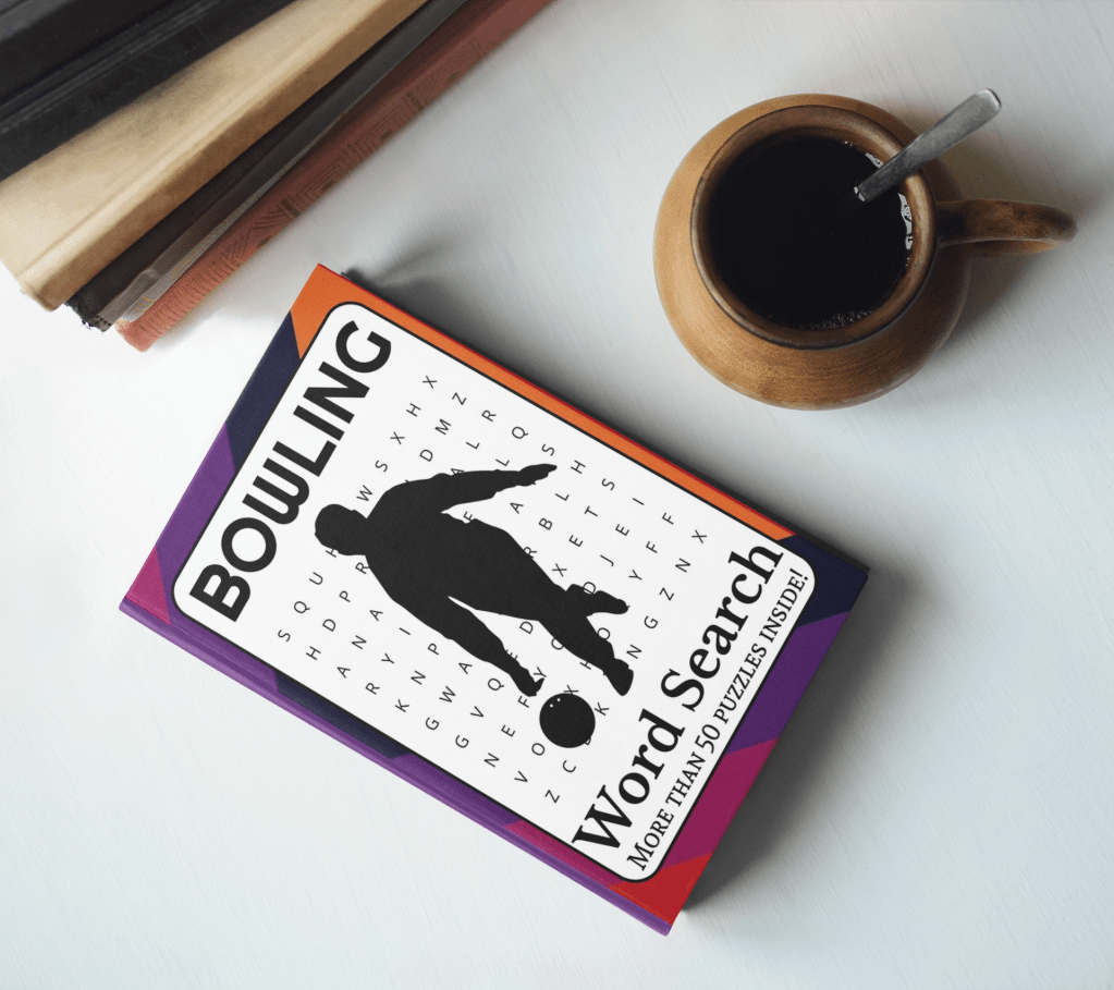 A Bowling Word Search Book on a table beside a cup of coffee and a stack of books.