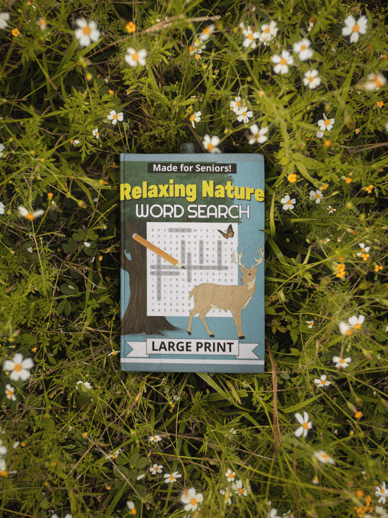 Relaxing Nature word search book lying on a field of flowers.